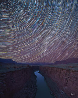 Star trails frame the sky over Marble Canyon in Grand Canyon from Navajo Bridge.