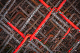 close-up pattern chain link fence with pattern and red paint 