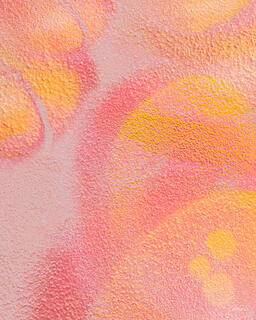 Shades of pink and yellow in graffiti-style artwork of circles and curves that looks soft and feminine.