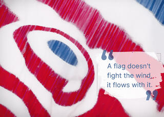 An abstract photo of an American flag flying and a quote about inner peace.