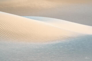 Soft ripples and hills in sand form after a windstorm at Death Valley.