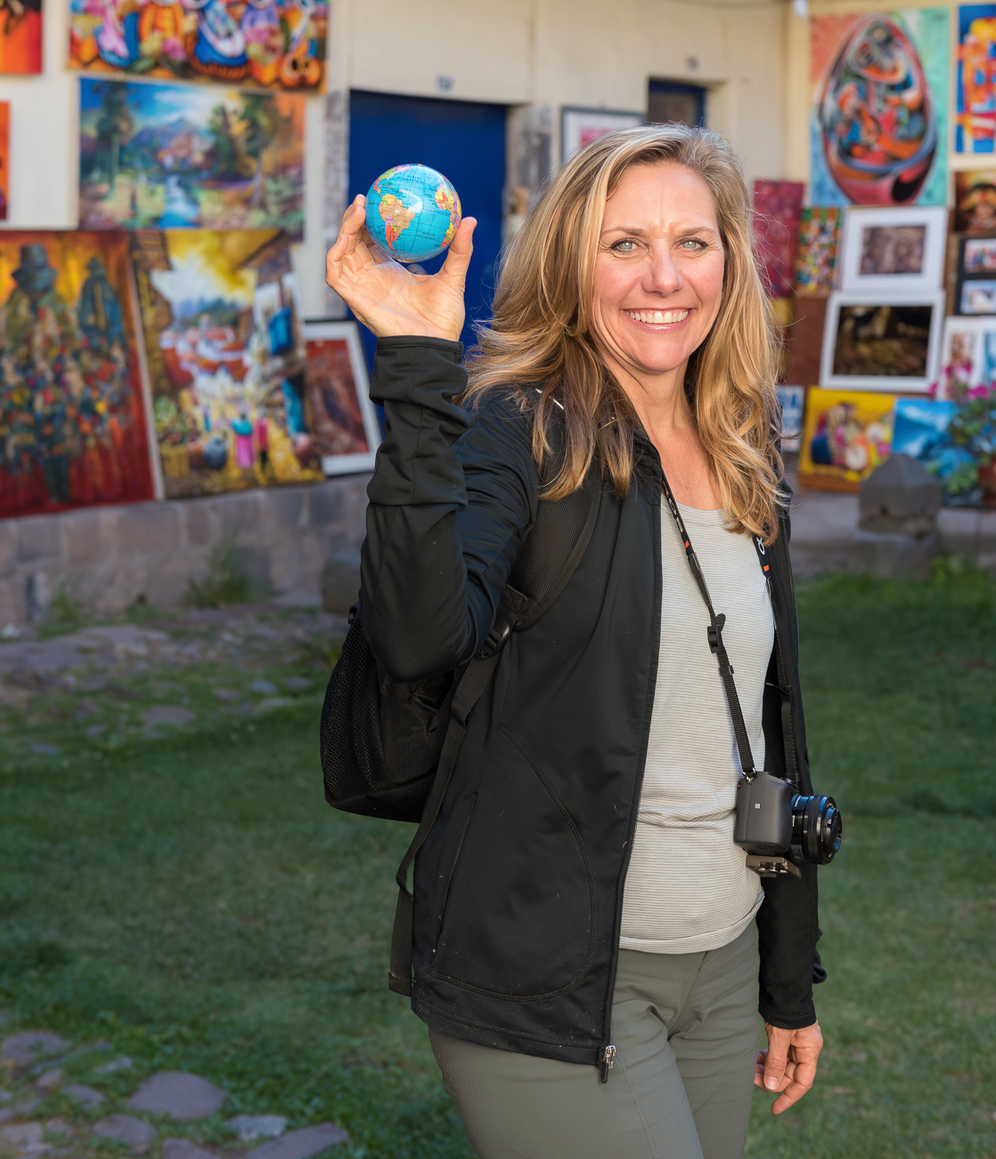 abstract photographer Ann Parks holding globe