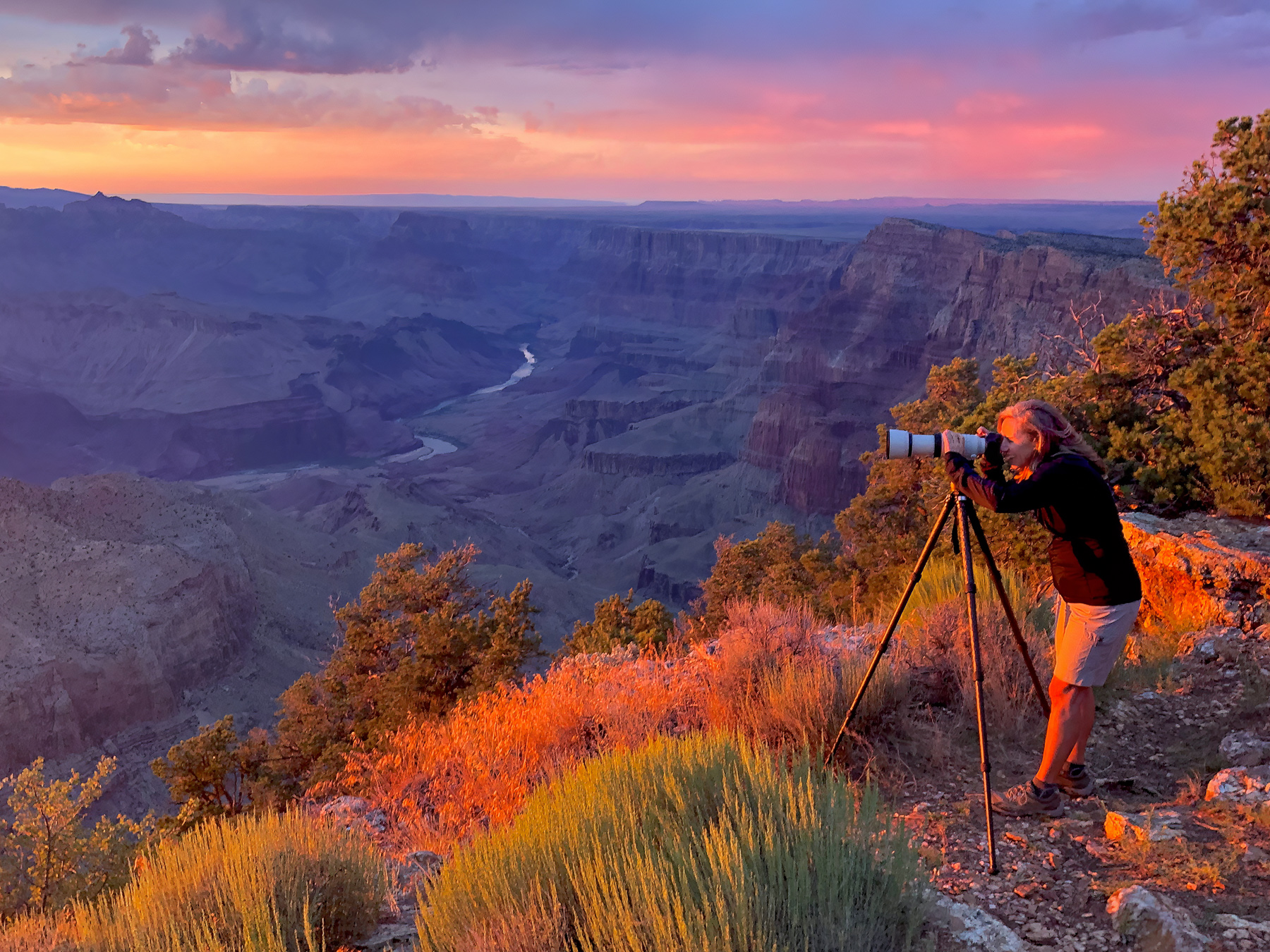 Abstract photographer taking photos at sunset in Grand Canyon