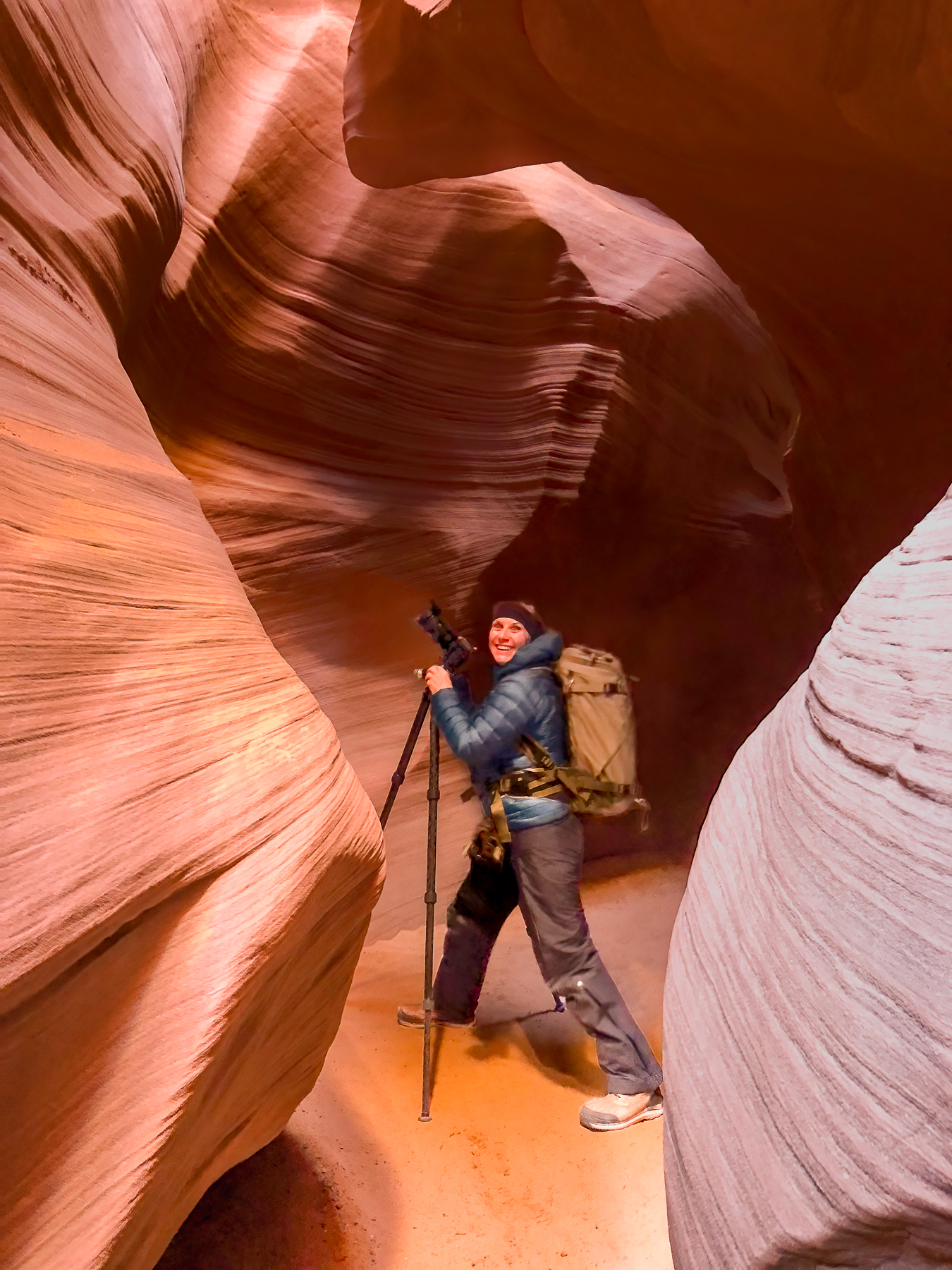 Abstract photographer in slot canyon taking pictures