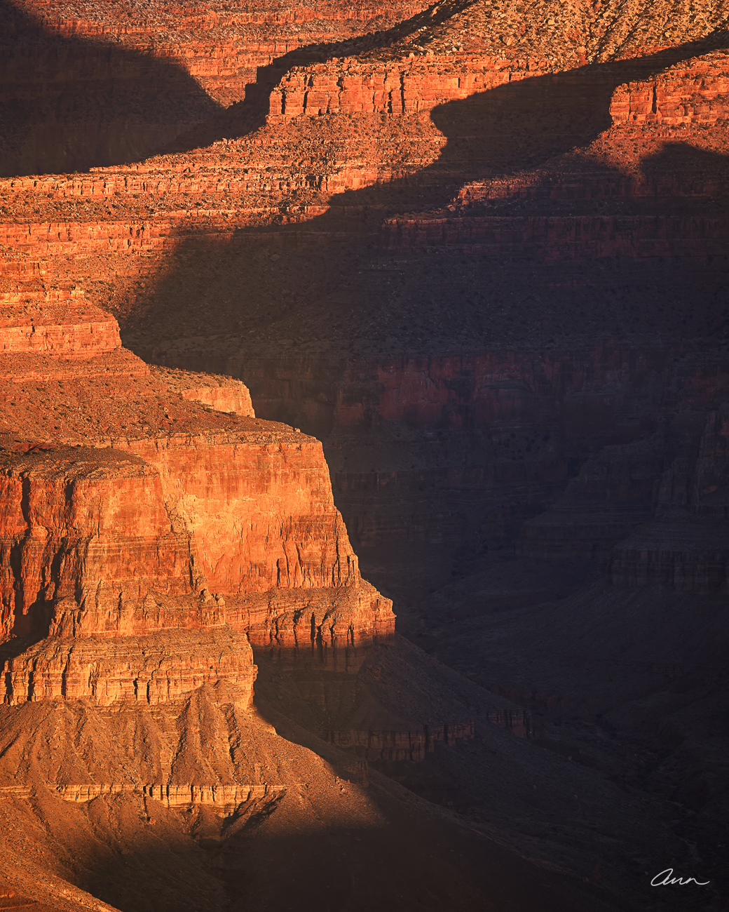Close up of Grand Canyon walls in winter with deep shadows and morning light.