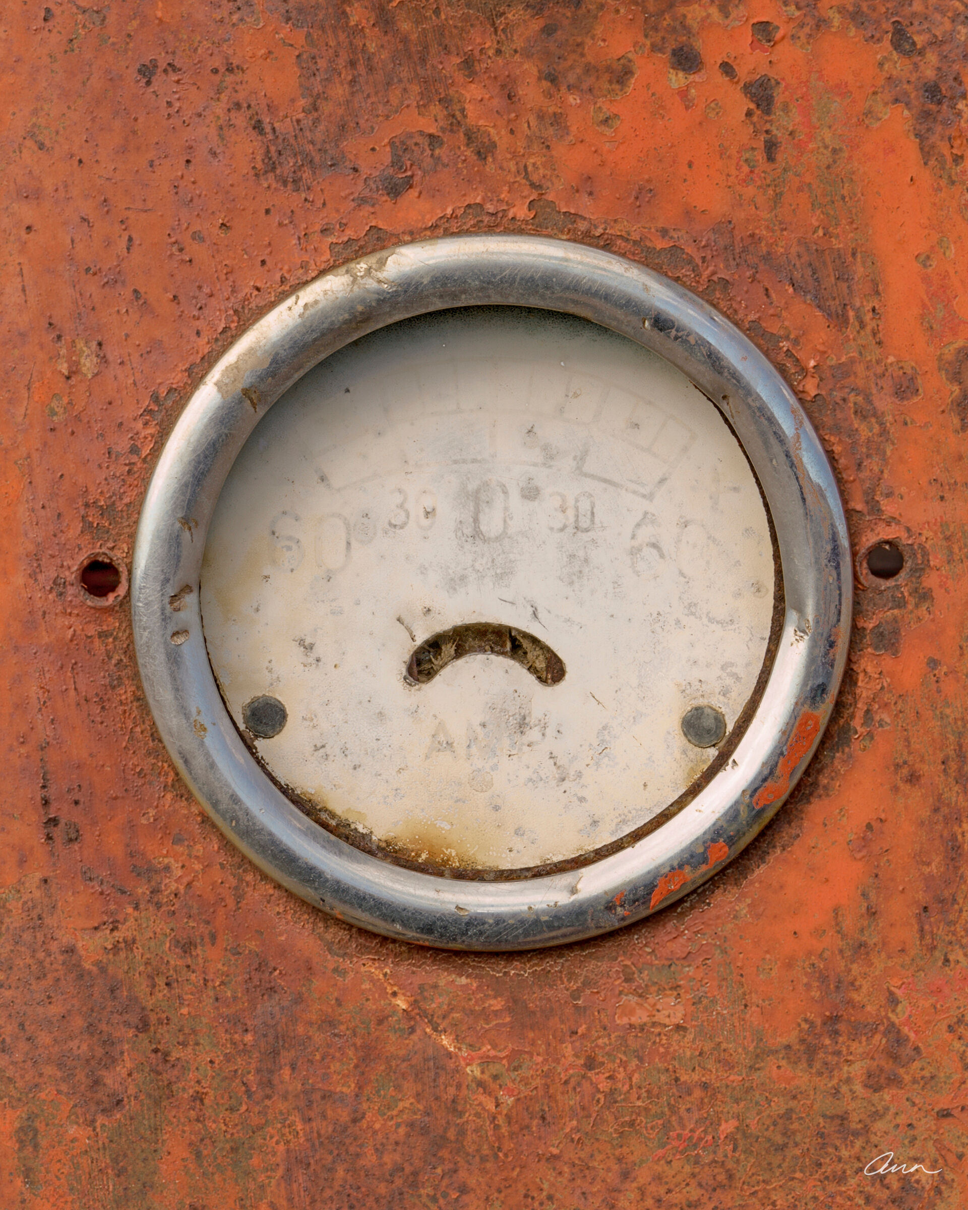 Upside down smile on antique truck meter