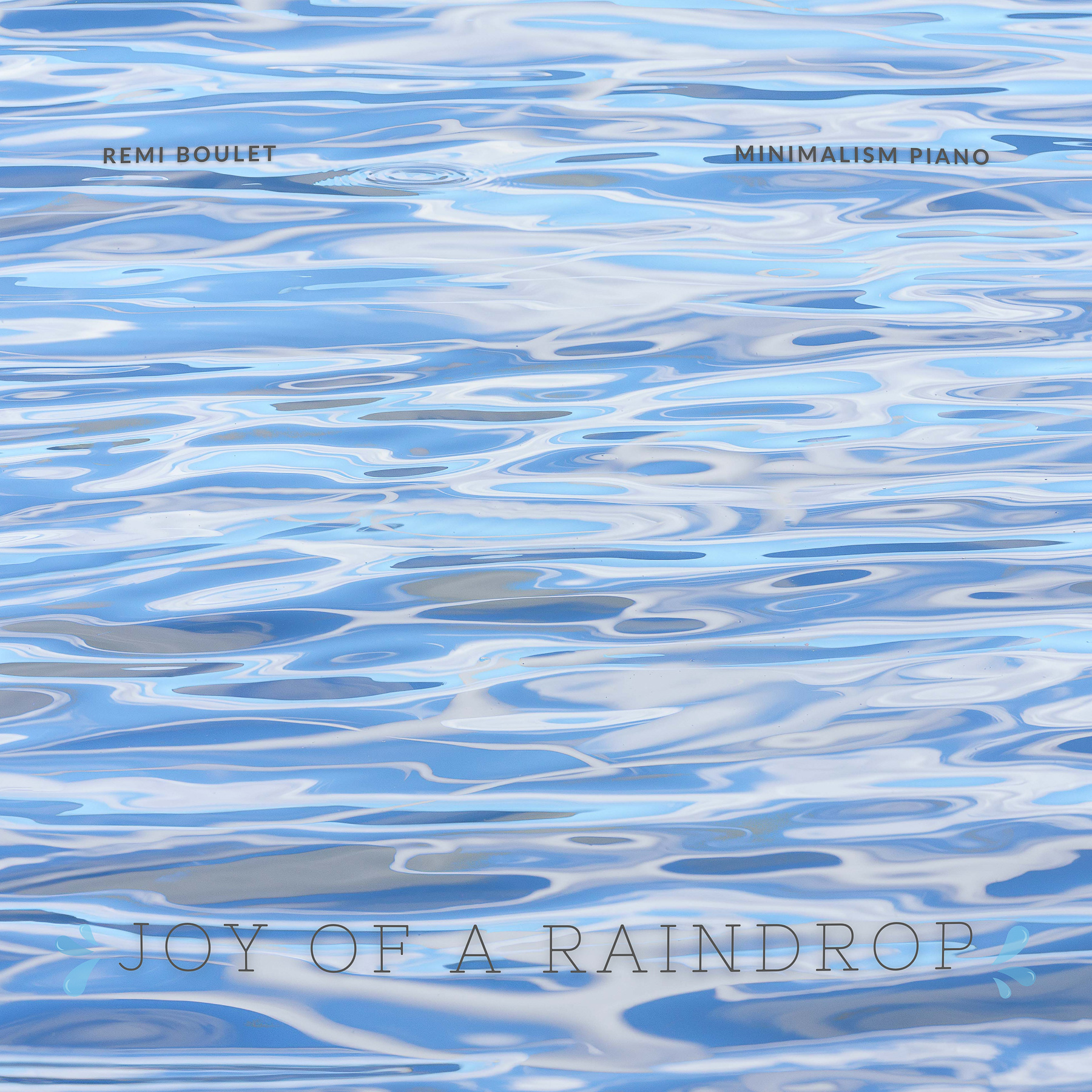 An abstract water ripple photo with a water droplet splash used for cool album cover art.