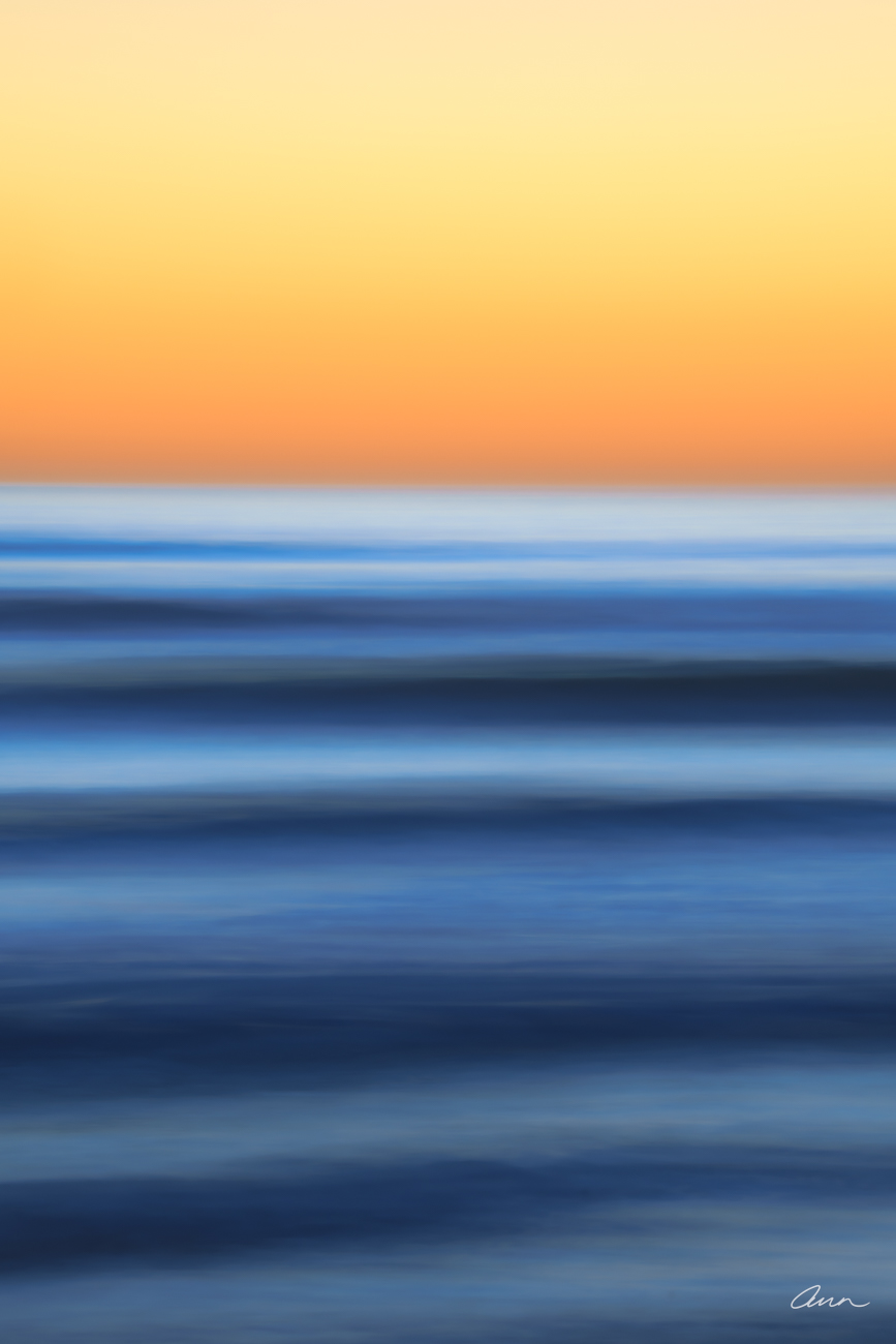 Slow rolling ocean waves at sunset